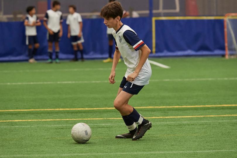 Boy playing soccer