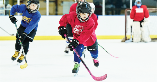 Kid playing hockey