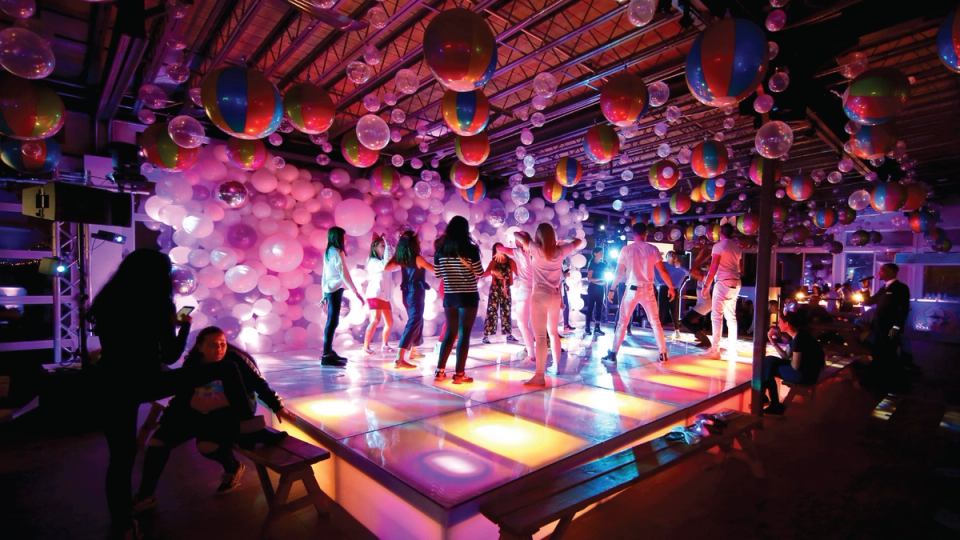 Dancing on the dance floor with balloons