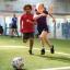 Kids running after a soccer ball
