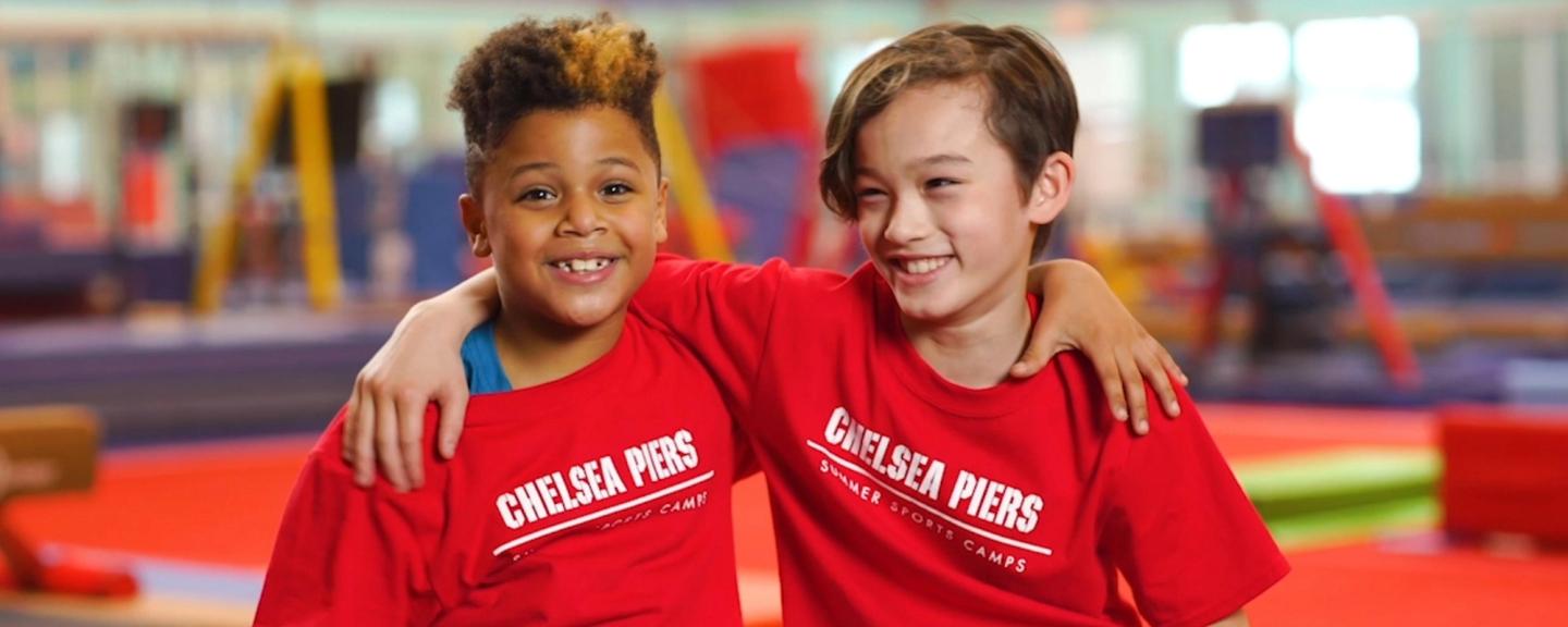 Two kids with their arms around each other and smiling