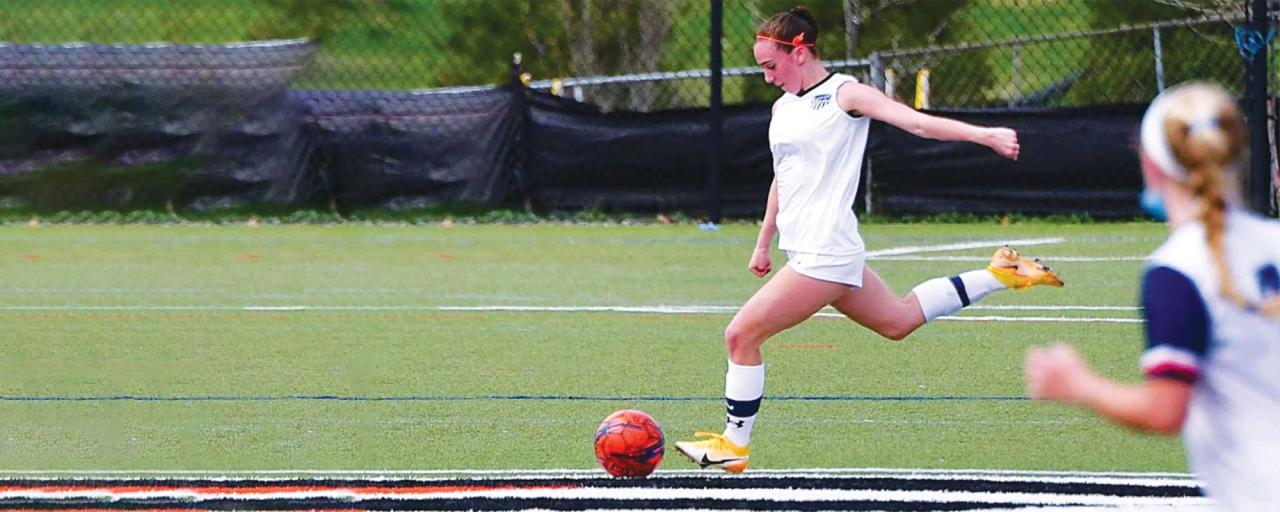 girl playing soccer