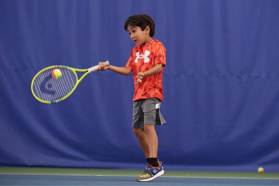 Tennis-Boy-Hitting-Forehand.webp