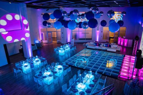 Bar Mitzvah space decorated with dancefloor and lighting