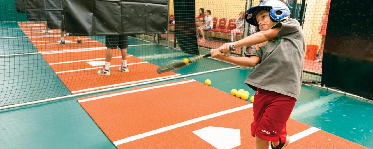 kid in batting cage