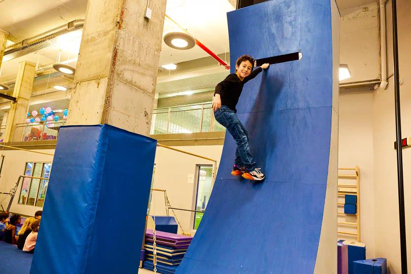 Kid climbing warped wall