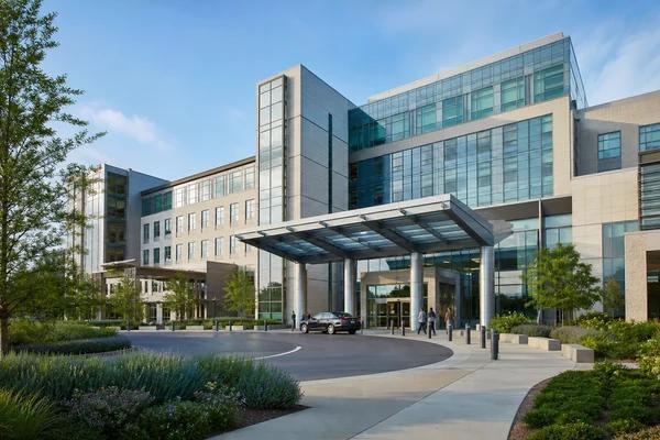 The anonymous front entrance of a modern major medical center.