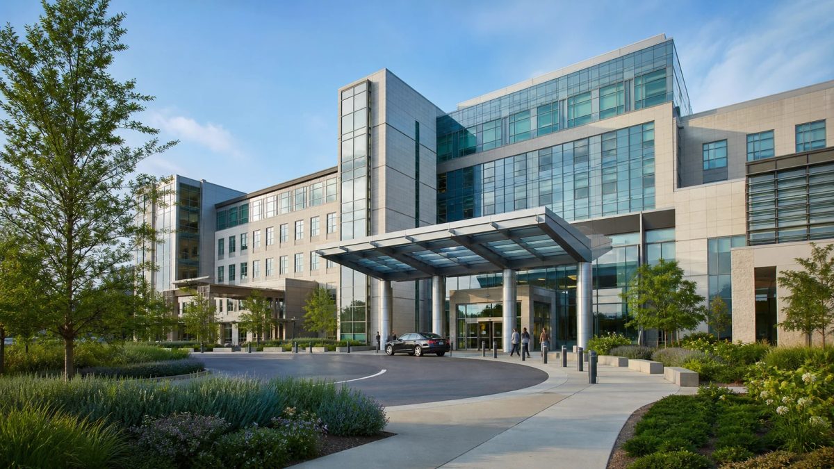The anonymous front entrance of a modern major medical center.