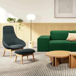 Modern chairs and wrap around green sofa