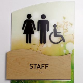 Sign on wall indicating staff bathroom