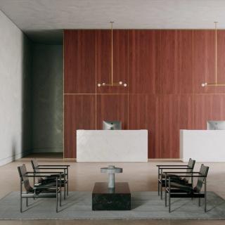 Room with cherry acoustic wood panels on wall and several chairs set around a coffee table