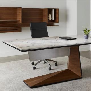 Marble desk with brown base and brown cabinet in the background
