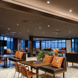 Router cut patterned panels on ceiling in dining space