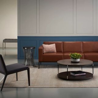 Ali sofa in room with blue wall and suo table