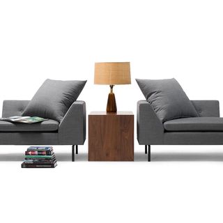 Fratelli sofas with wooden table and lamp in middle