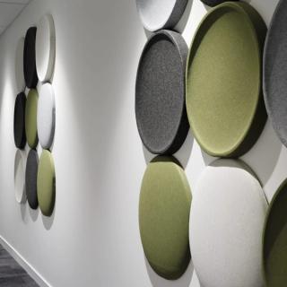 Circular acoustic 3d tiles mounted to wall