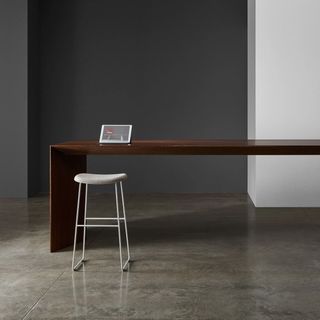 Meich table with gray chair and tablet computer