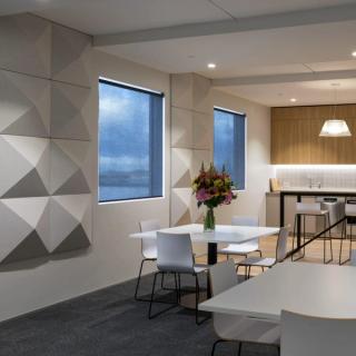 Gray acoustic 3d square tiles in a room