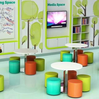 Colorful children's area with seating and library of books built into wall