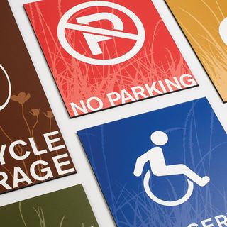 Various colorful signs for parking and handicap