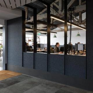 Dark blue acoustic panels in open office