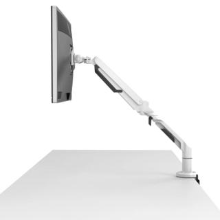 Monitor with arm attached to desk from a side view