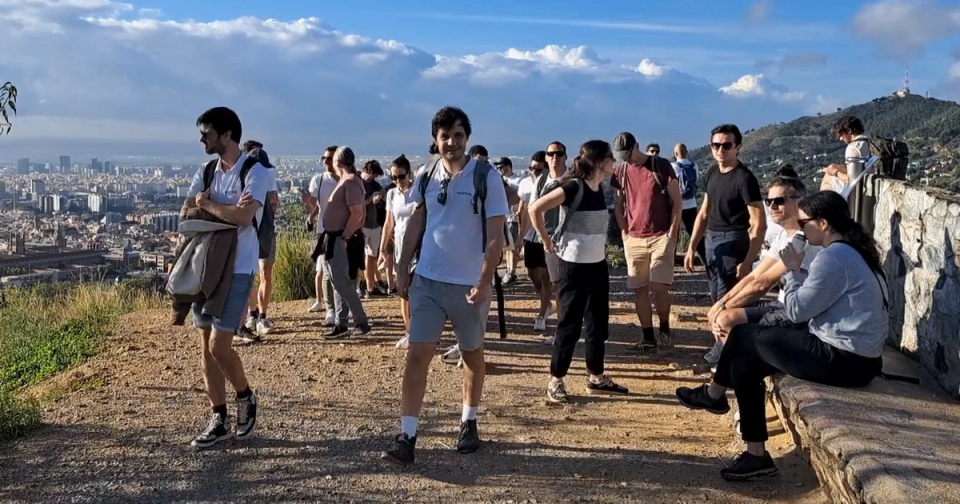 Colleagues hiking in the hills above Barcelona during a company offsite organised by Nessout