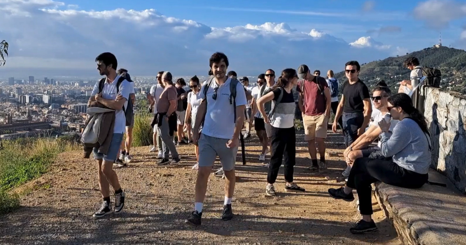 Colleagues hiking in the hills above Barcelona during a company offsite organised by Nessout