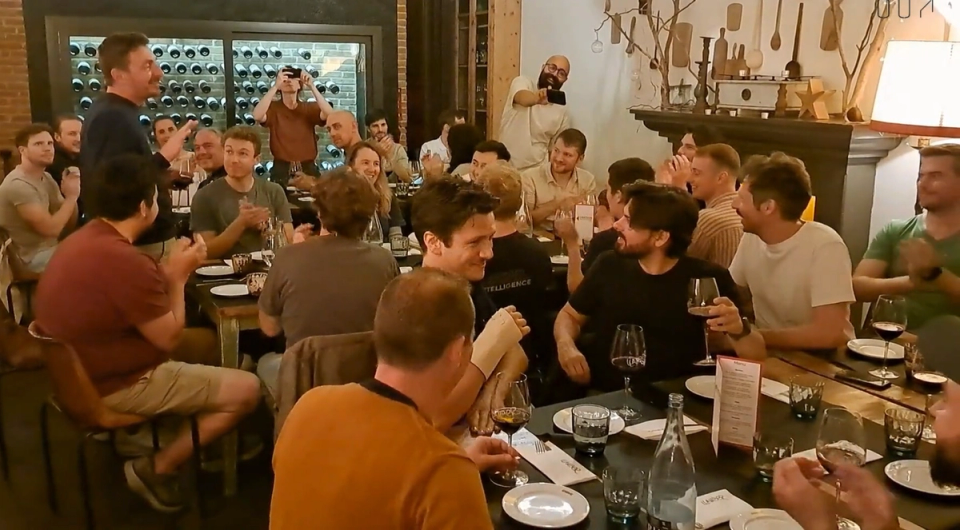 Corporate group enjoying a group dinner in a tapas bar in Barcelona during a company trip organised by Nessout
