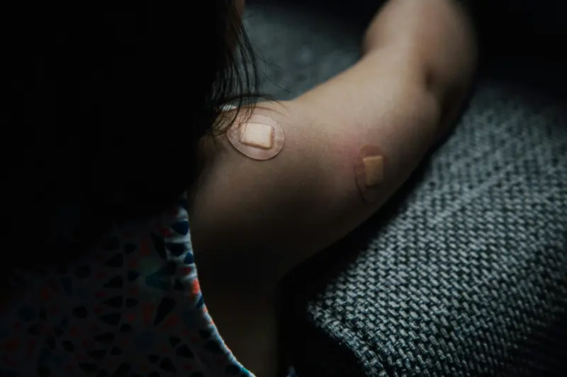 person with bandage - Does Semaglutide Cause Bruising