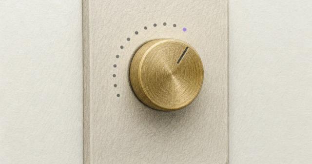 Brass dimmer dial turned partway with dotted arc markers around it