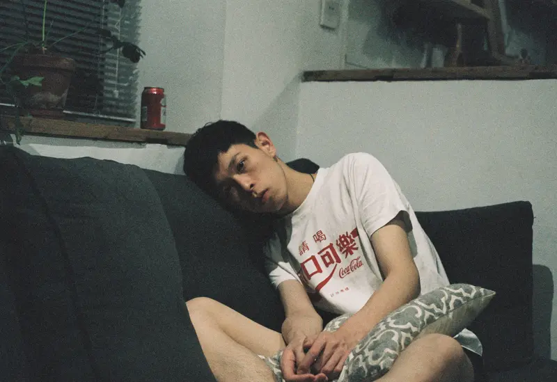 person is layong on sofa - Does GLP-1 Make You Tired?