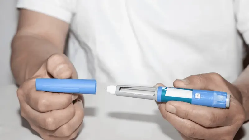 Man preparing medical injection pen - Can You Take Semaglutide Every Other Week for Weight Loss