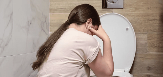 Woman experiencing GI distress on Zepbound — symptoms peak during dose-escalation weeks