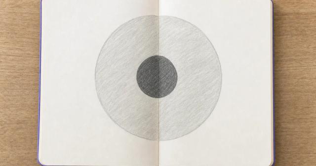 Hand-drawn diagram of a small solid circle inside a much larger faintly shaded circle