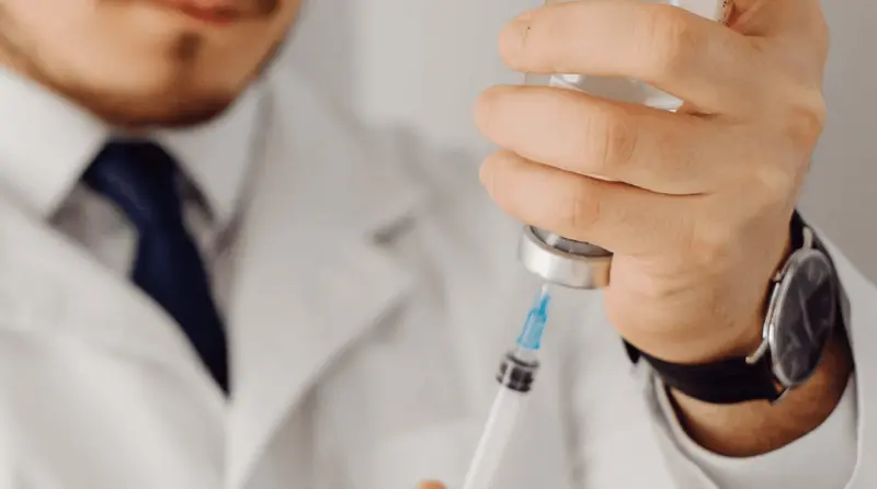 Doctor filling syringe - Compounded Semaglutide Side Effects