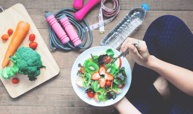 Healthy meal surrounded by fitness equipment - Top 15 Foods to Avoid While on Semaglutide