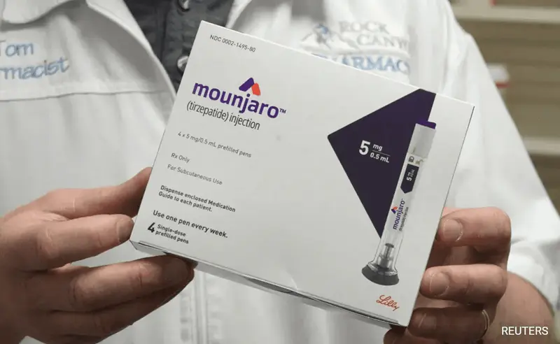 person presenting medicine - Does Mounjaro Show Up in Blood Work