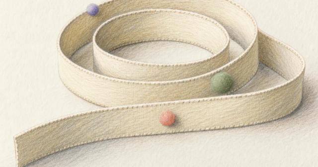 Close-up of a blank coiled cloth measuring tape with three small dotted markers