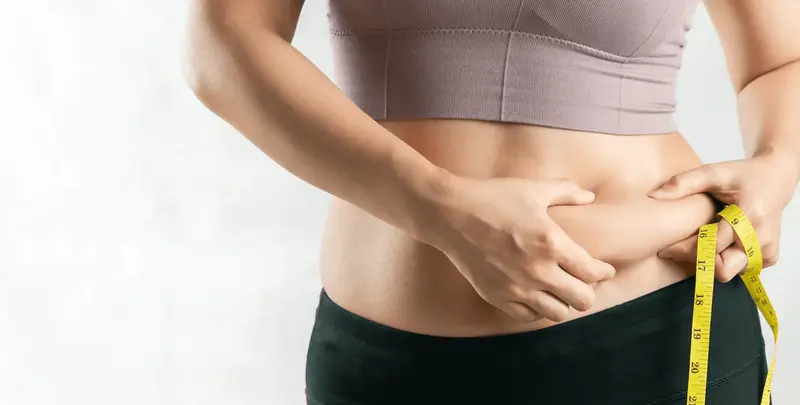 Woman measuring waist with tape - Who Should Not Take Semaglutide