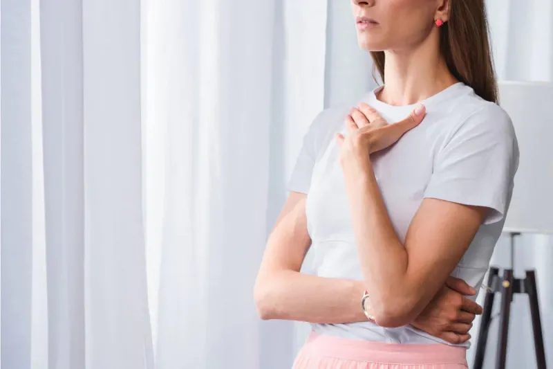 person holding breath - Does Ozempic Cause Hiccups