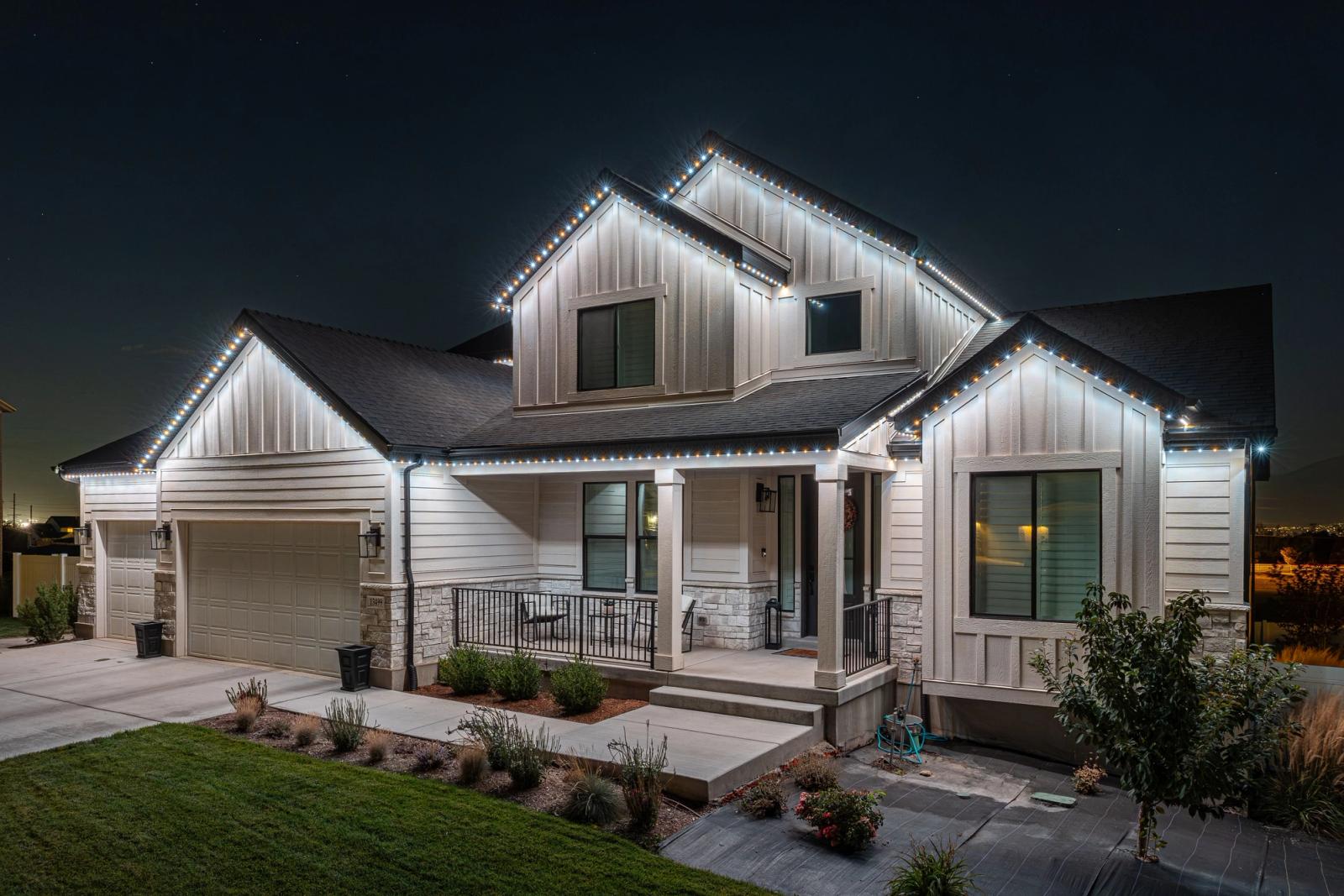 Same home at night with permanent LED trim lighting turned on