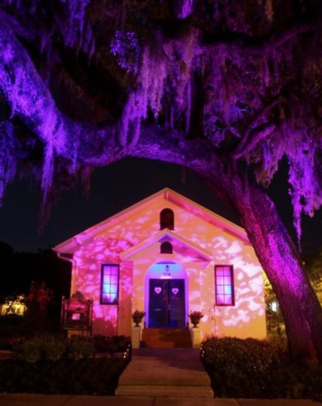 Event lighting: chapel purple projection exterior