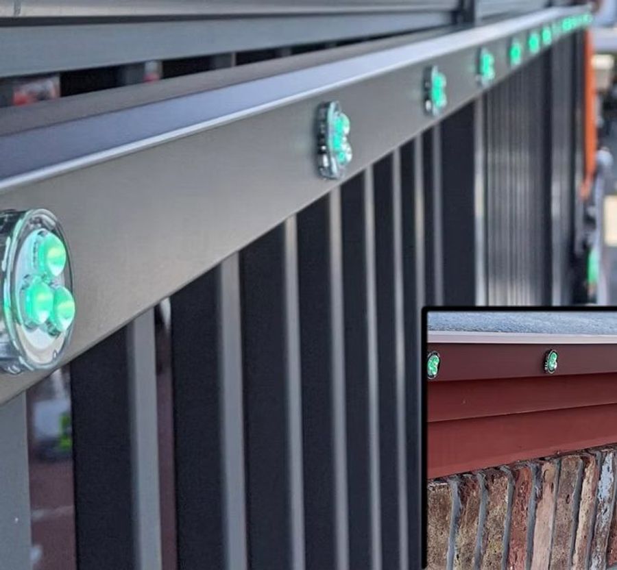 Close-up of Trimlight LED lights installed in the channel under a roofline