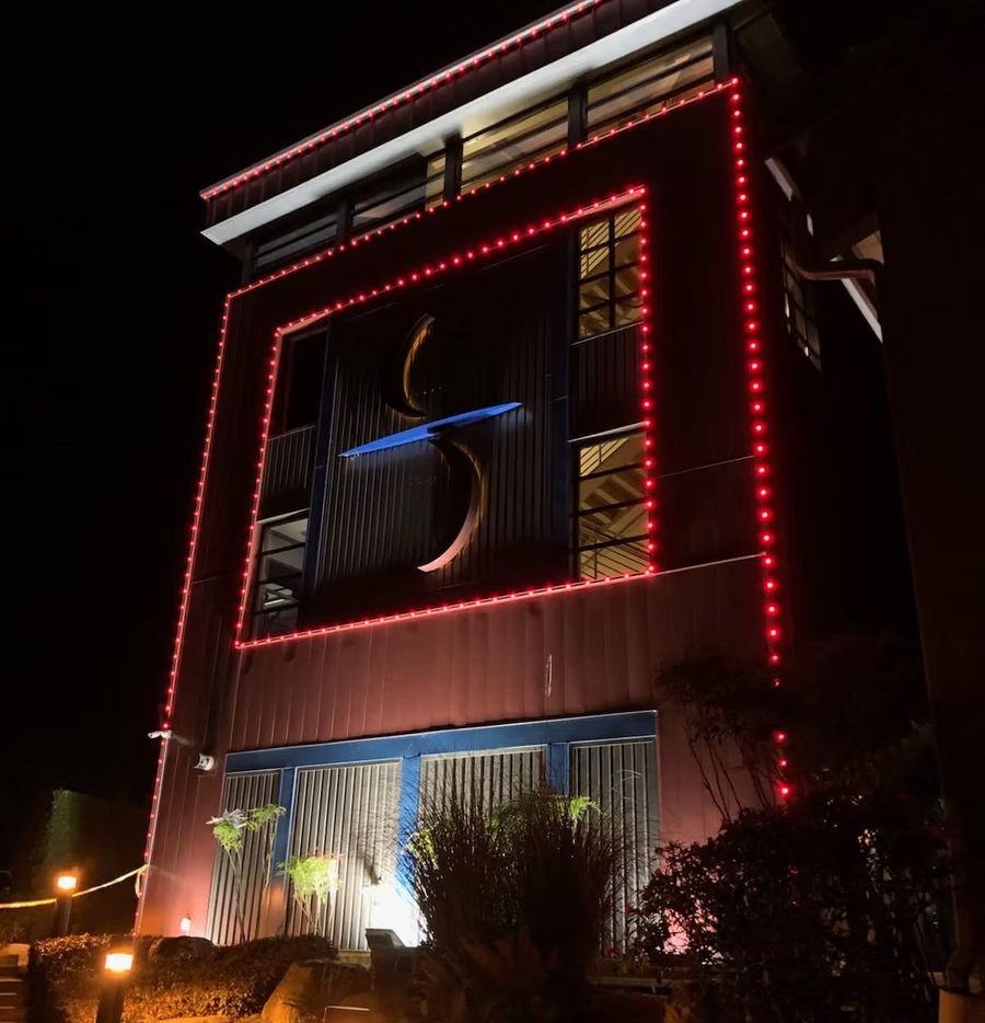 Permanent LED lighting outlining a commercial building