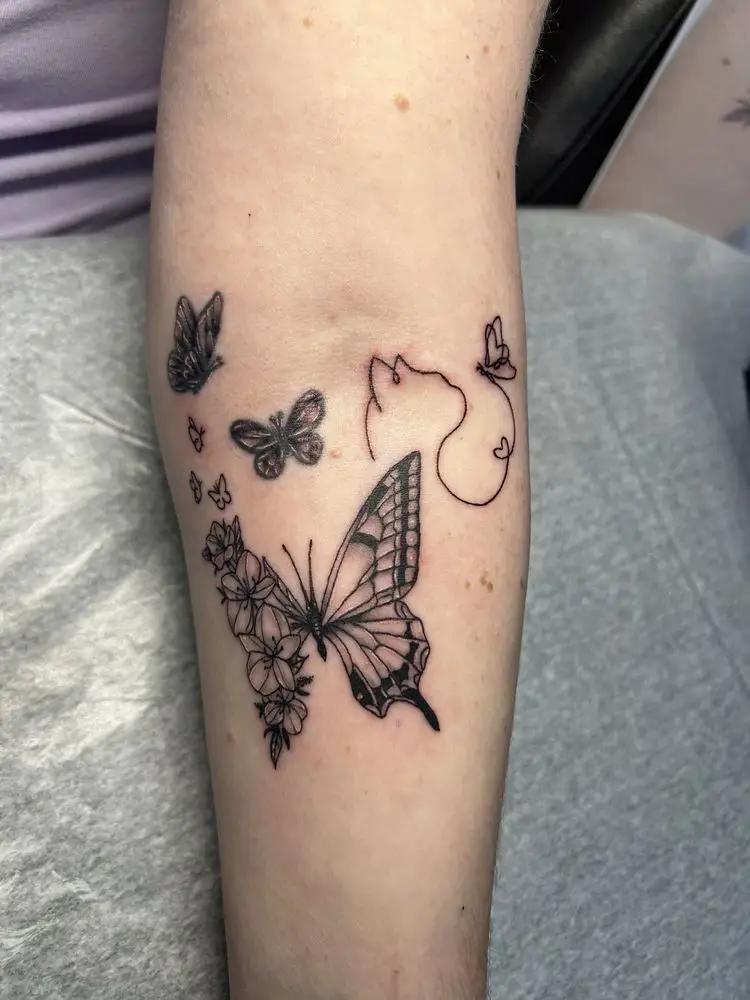 Fine Line Butterfly Tattoo at New Wave Body Art Studio