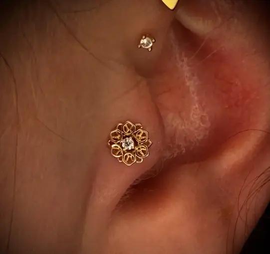 Gold Floral Ear Piercing at New Wave Body Art Studio