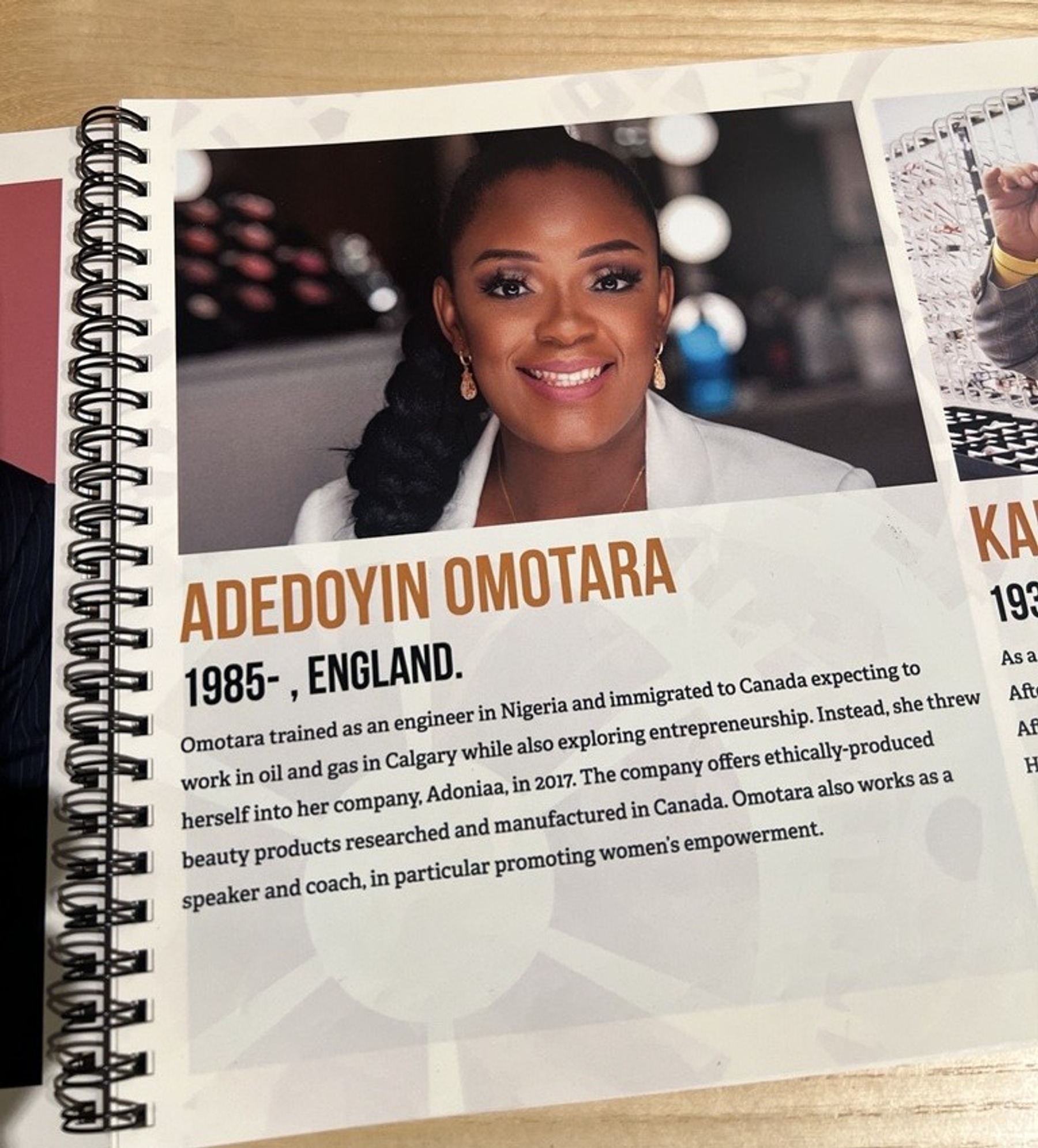 A page from a publication in a national museum, on the page is a photo of a woman and her professional bio written below.