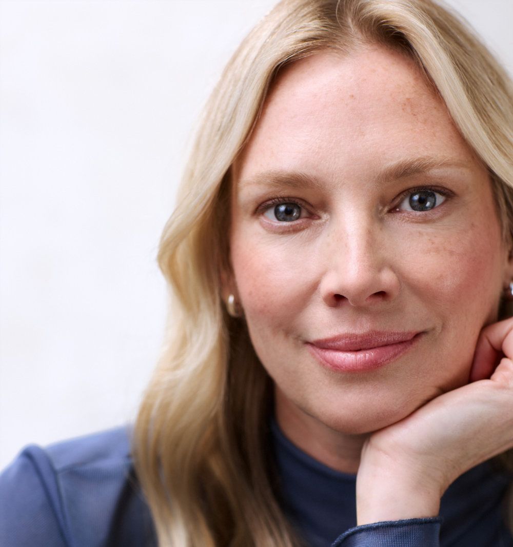 Blonde woman looking at camera. 