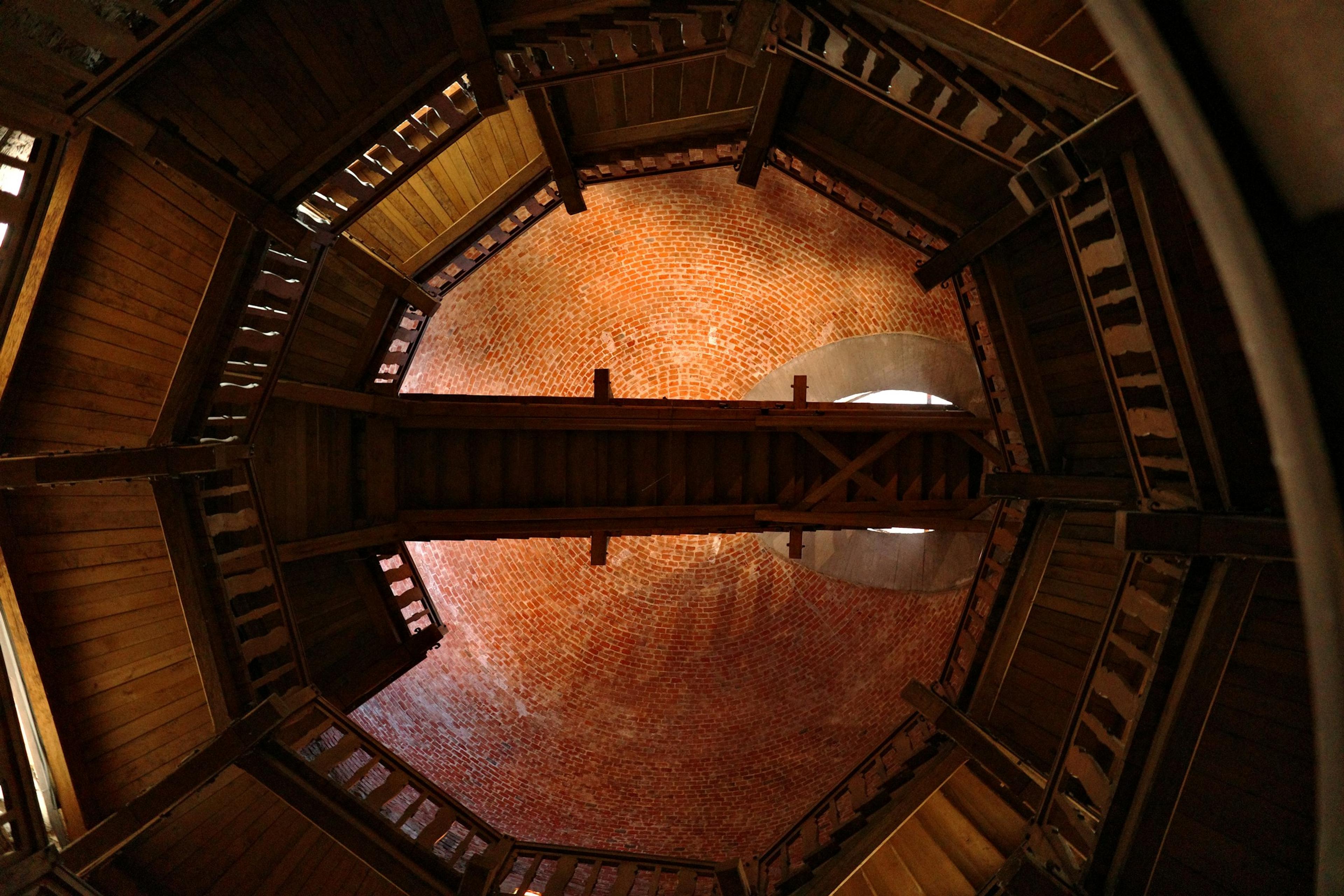 Octagonal timber structure with a central walkway and dome